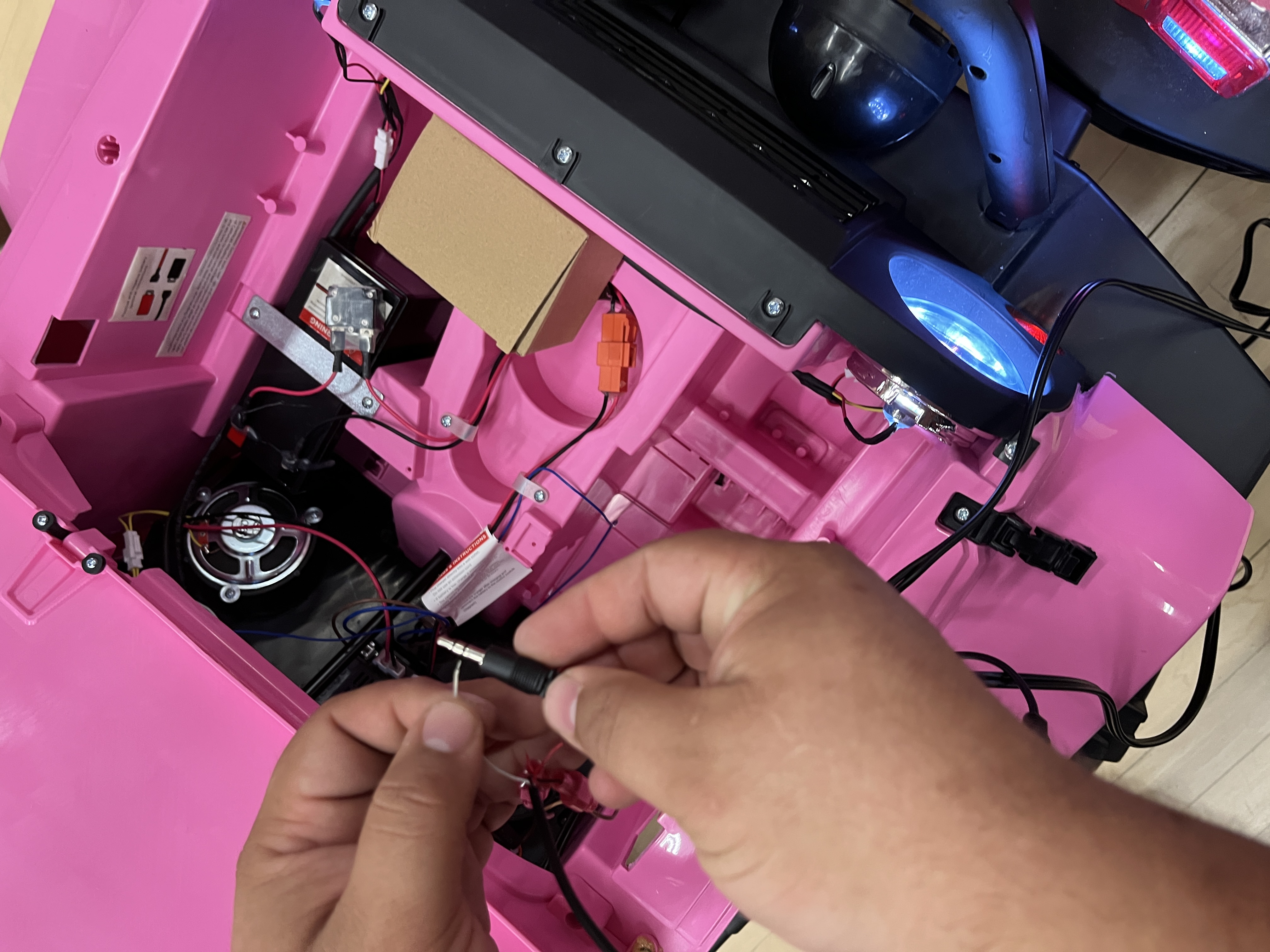 Close-up of hands working on wiring system