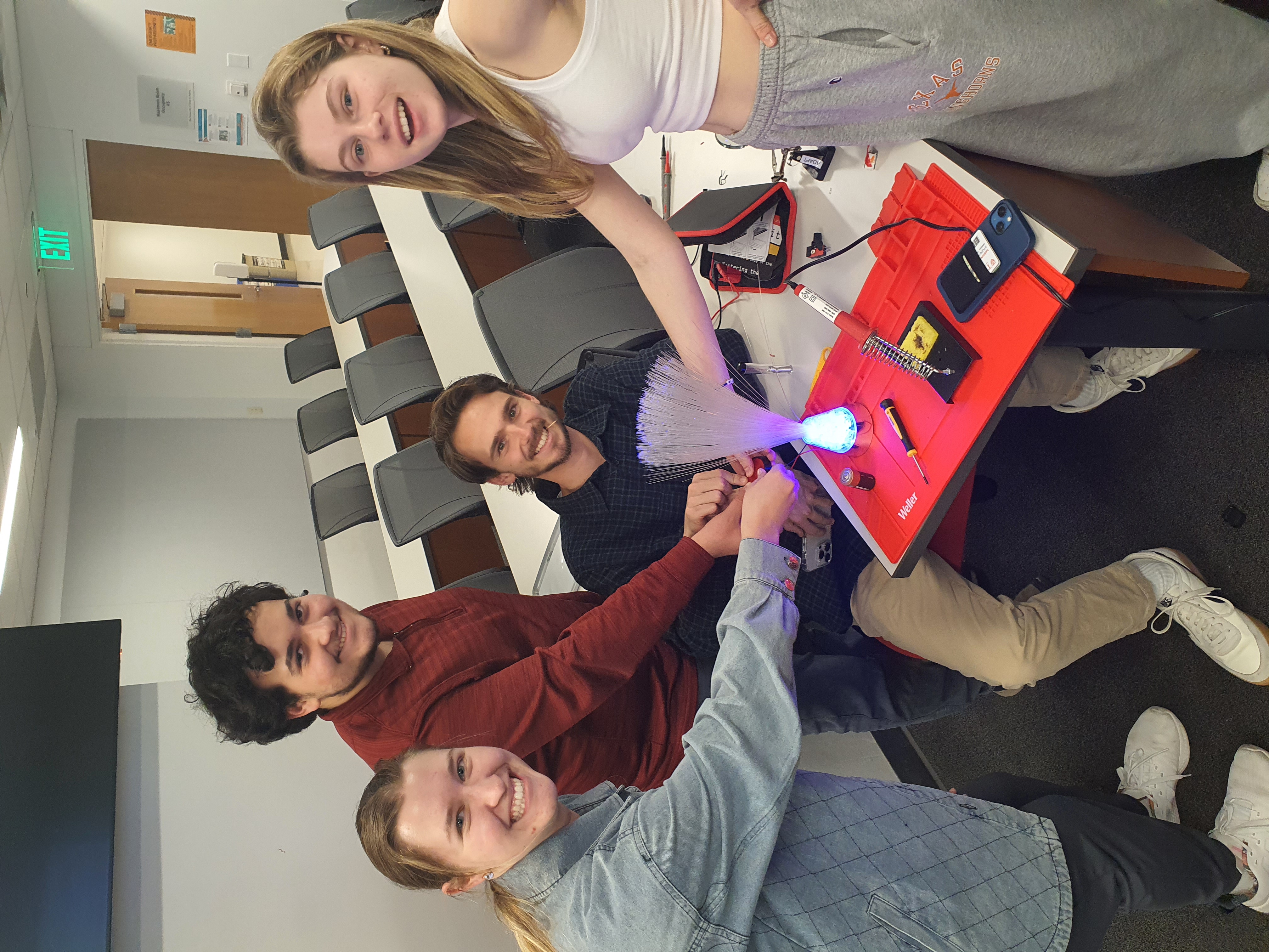 ADAPT Texas students collaborating on an adaptive device